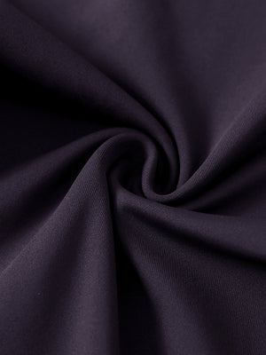 Close-up of ultra-stretch quick dry fabric used in dark purple women's golf sweatpants