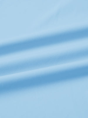 Close-up fabric detail of lightweight golf quarter zip pullover, smooth texture and breathable feel in light blue