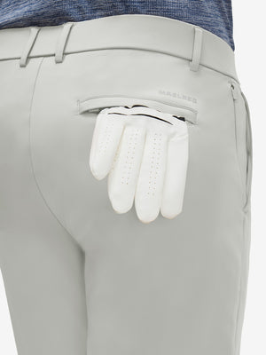 Detail view of back pocket on silver gray flat front golf joggers pants with belt loops
