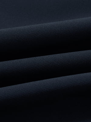 Close-up of wrinkle-resistant, sun-protective fabric on water-resistant golf stretch nylon pants in navy.