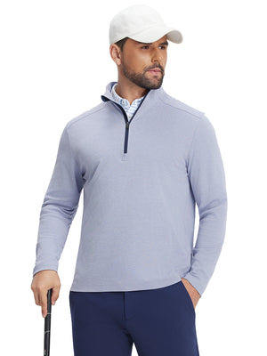 Front upper body view of model holding a golf club in sky blue two tone pique cotton blend q-zip