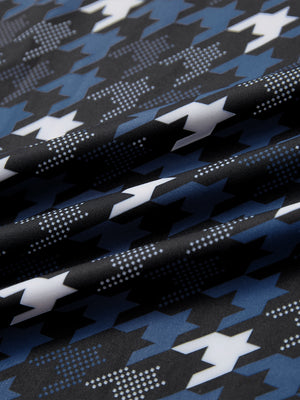 Close-up of blue/black houndstooth full print lightweight quarter zip pullover fabric, soft and breathable texture