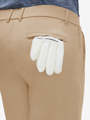 Detail view of back pocket on light khaki  flat front golf joggers pants with belt loops