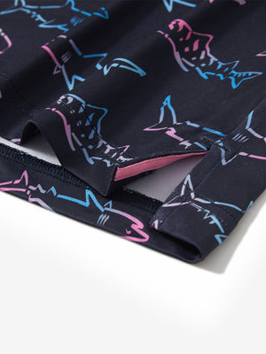 Close-up of the hem vent on the ombre shark 4 way stretch print collared polo shirt, showing the side split for movement