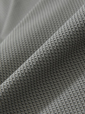 Close-up of the textured jacquard fabric on the black feather weight jacquard polo shirts