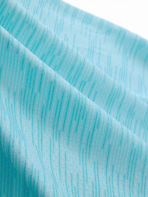 Close-up of misty blue ultra-light quick dry moisture wicking collared polo shirt fabric texture