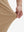 Detail view of pants elasticity on light khaki  flat front golf joggers pants with belt loops