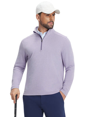 Front upper body view of model holding a golf club in lanvender two tone pique cotton blend q-zip