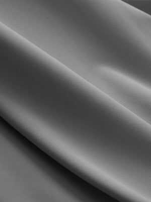 Close-up texture of iron gray breathable casual slacks with 4 pockets fabric showing detailed breathable material and weave.