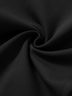 Fabric close-up showing the fleece stretch material of black fleece stretch water resistant boys joggers.