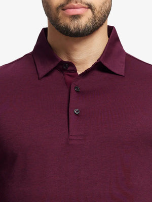Model front close-up from nose to chest wearing Ventilated Heather Jacquard Polo in BURGUNDY HEATHER