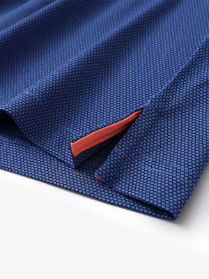 Close-up of side hem slit detail on PLUM BLUE Performance Ananas Jacquard Polo