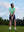 Model in light green your favorite jacquard polo preparing to tee off, full-body shot