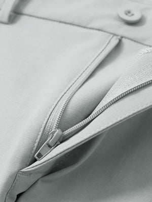 Detail view of the zipper on the rose dust youth water resistant cotton blend golf pants, highlighting secure closure