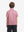 Back half-body view of youth wearing pinkdonut performance print boys golf polo, showing rear design