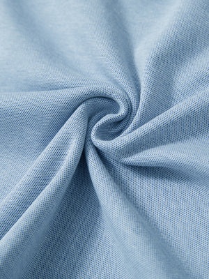 Fabric close-up showing the material of light blue two tone pique cotton blend q-zip.